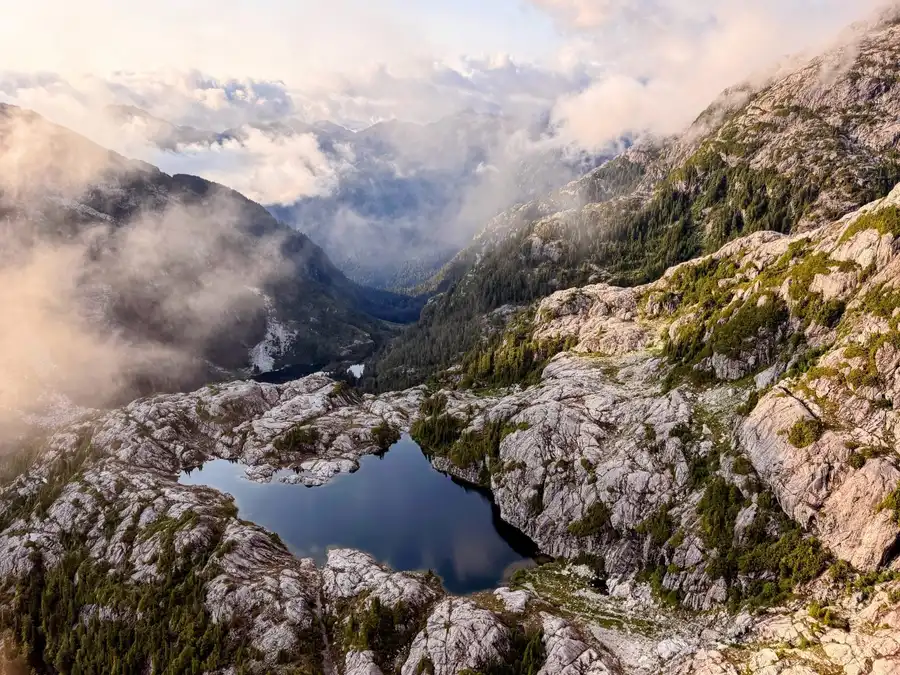 A tarn in the clouds, photographed on a ridge hike for the winter series