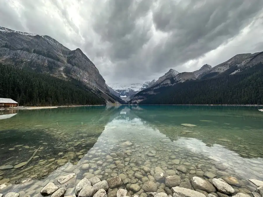 Still water and storm clouds on the morning of a September elopement