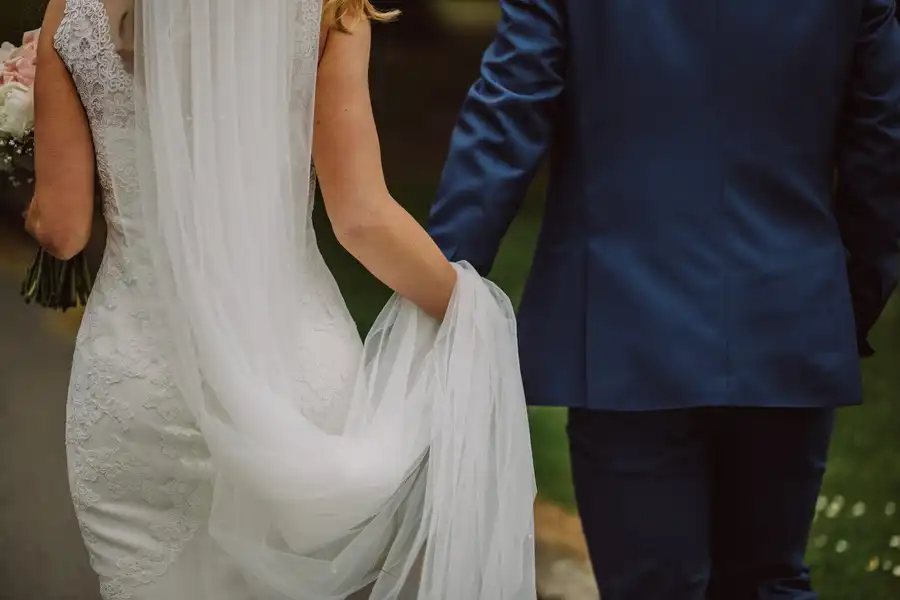 Walking out together after a ceremony for twelve guests
